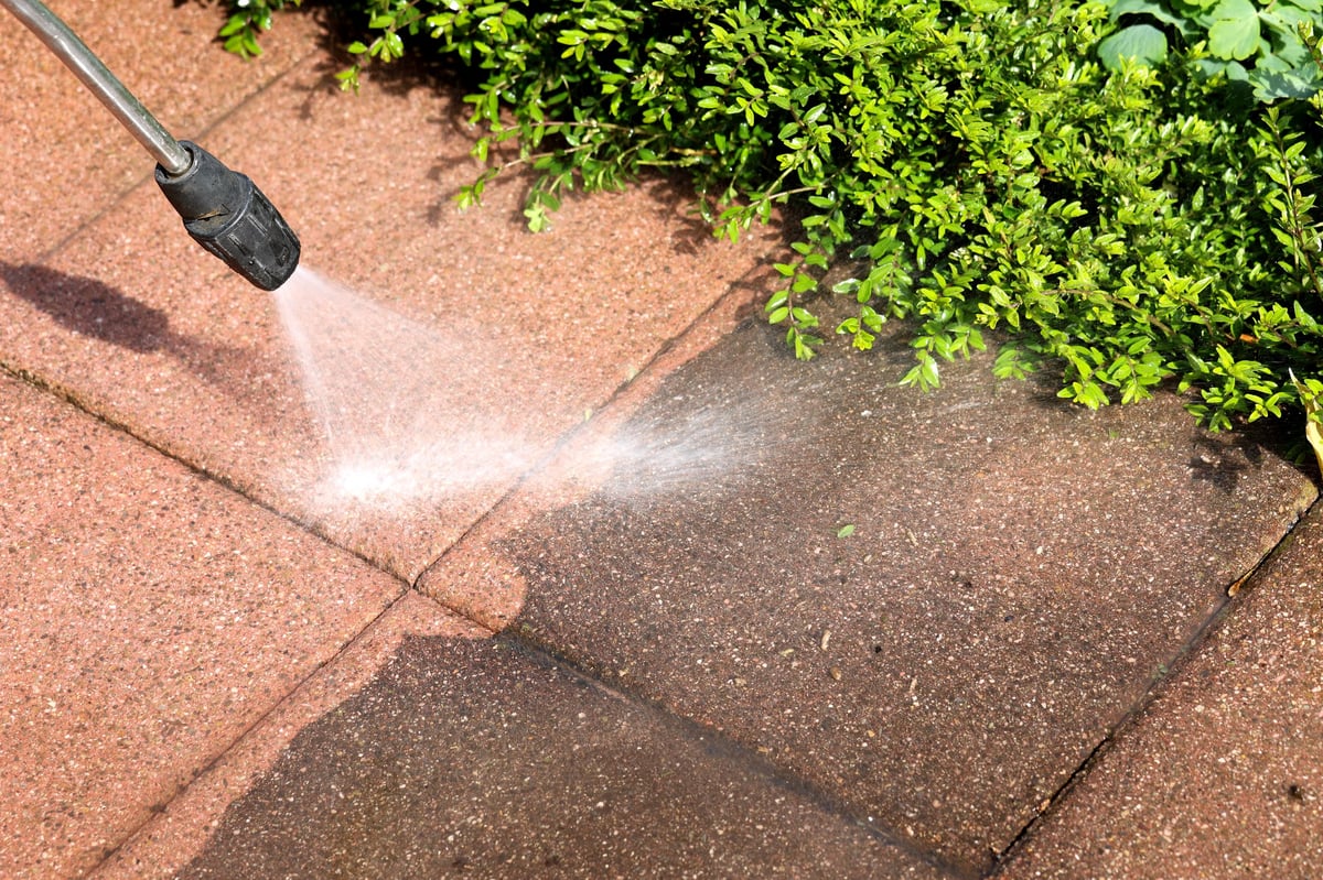 Cleaning a terrace and paths with a high-pressure washer